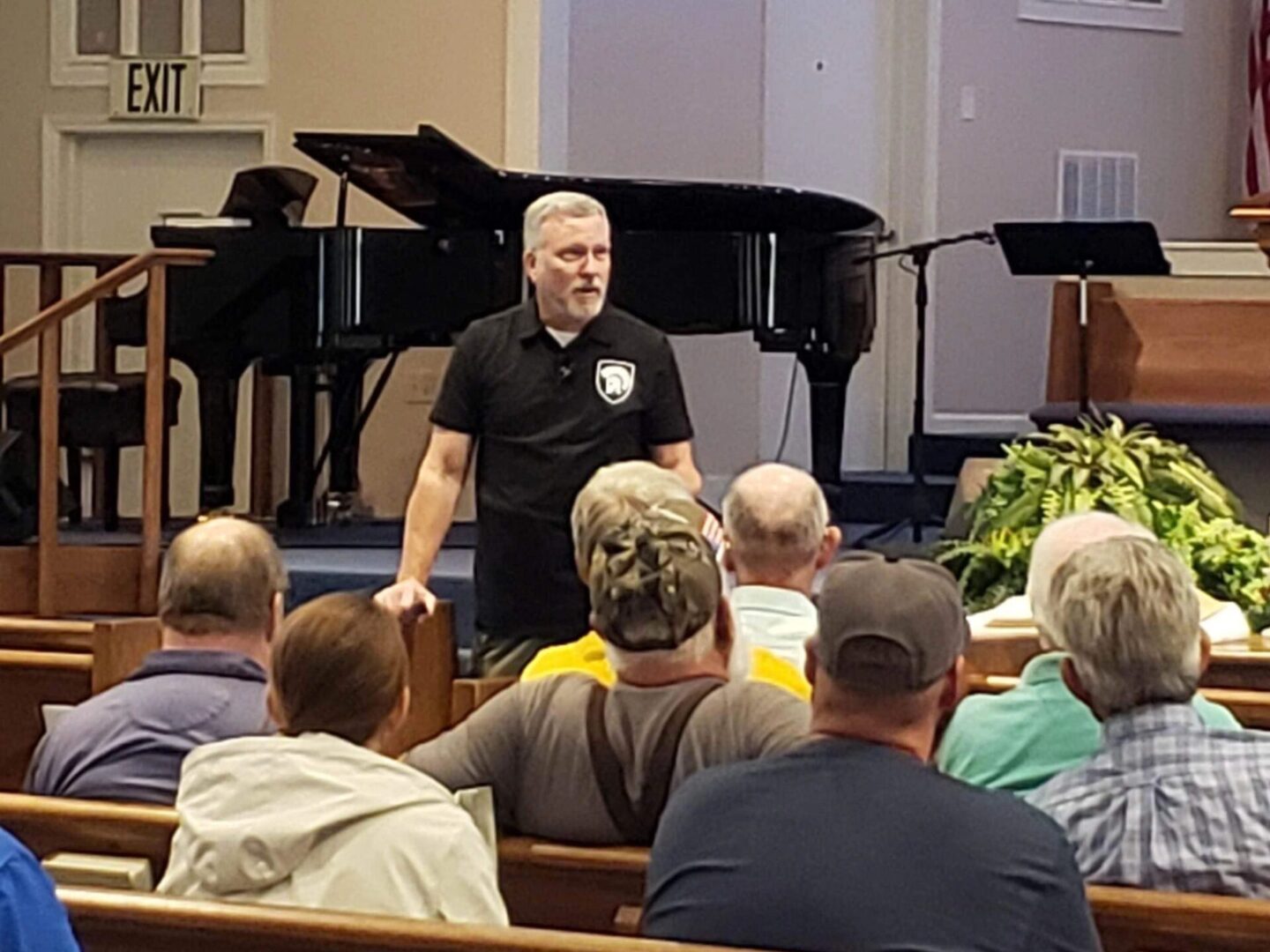 A man standing in front of a group of people.